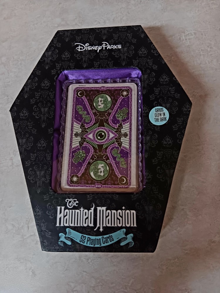 DISNEY HAUNTED MANSION GLOW IN THE DARK 52 PLAYING CARDS PURPLE COFFIN CASE